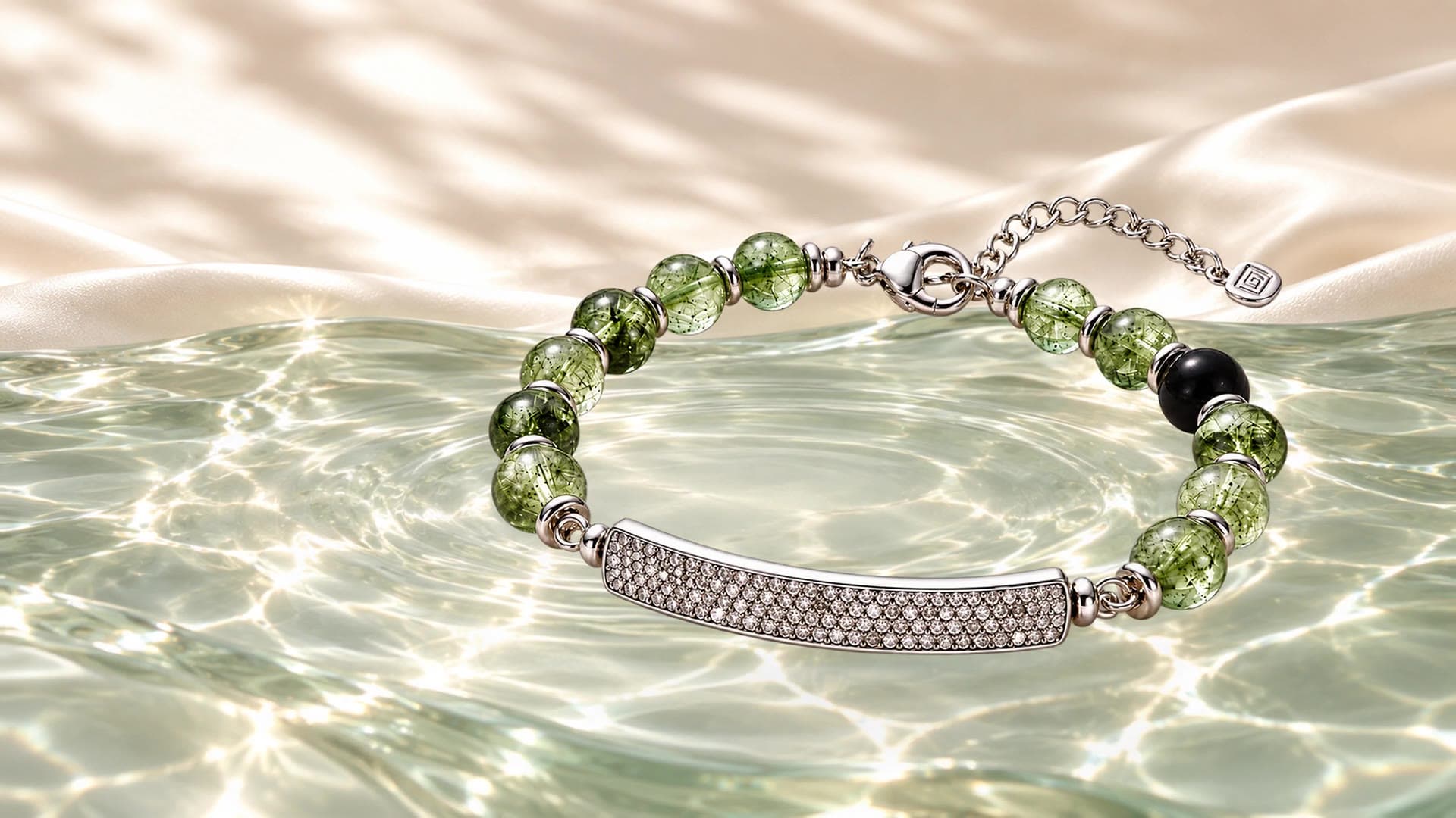 QiLyra bracelet resting on a warm beige surface, with soft rippling light moving across the stones and silver bar.