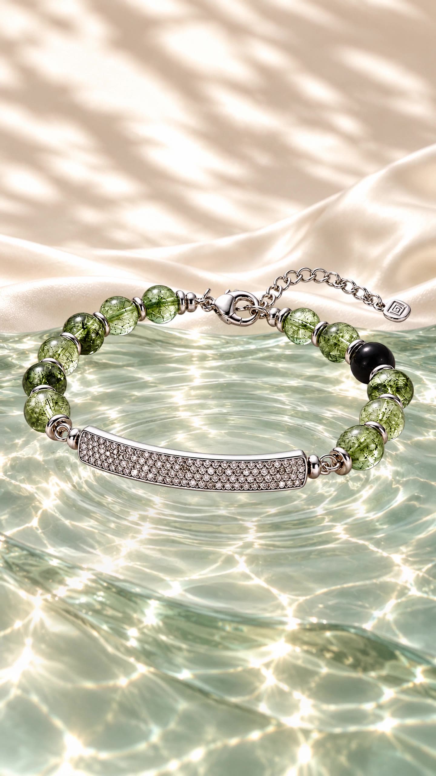 QiLyra bracelet resting on a warm beige surface, with soft rippling light moving across the stones and silver bar.